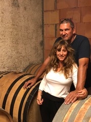 Portrait of a man and woman at Princess & Bear Wines, showcasing craftsmanship.